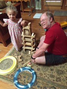 Grandpa and Isis playing with blocks